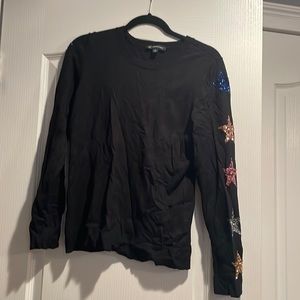 Black sweater sparkly star details on sleeves